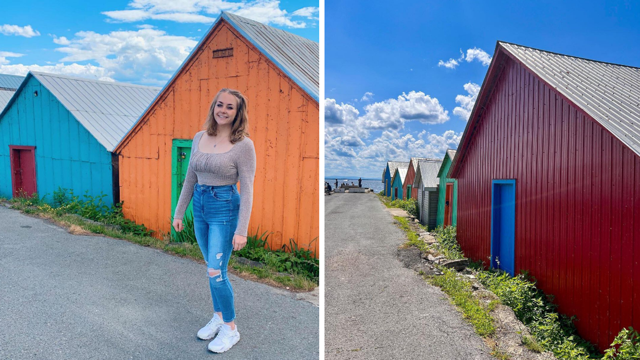 Bright colourful boat houses lining a waterfront wharf in Ontario.