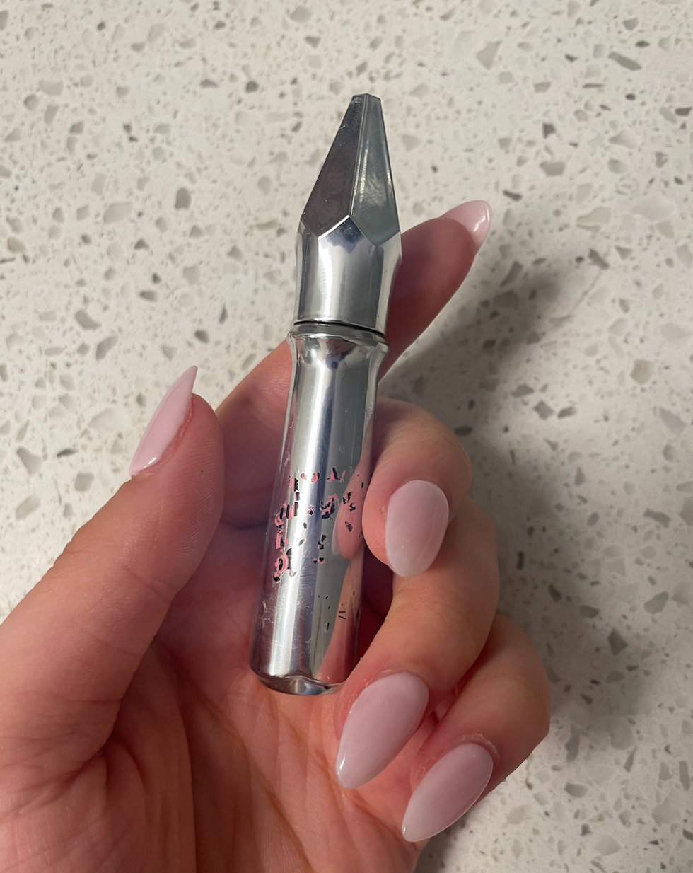 Brooke Houghton holding an eyebrow gel.