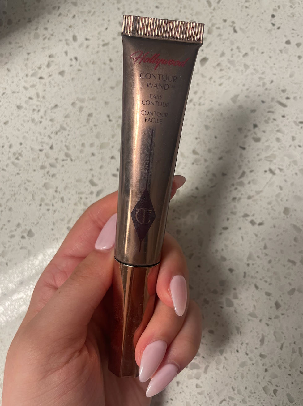 Brooke Houghton holding the Charlotte Tilbury Hollywood Contour Wand.