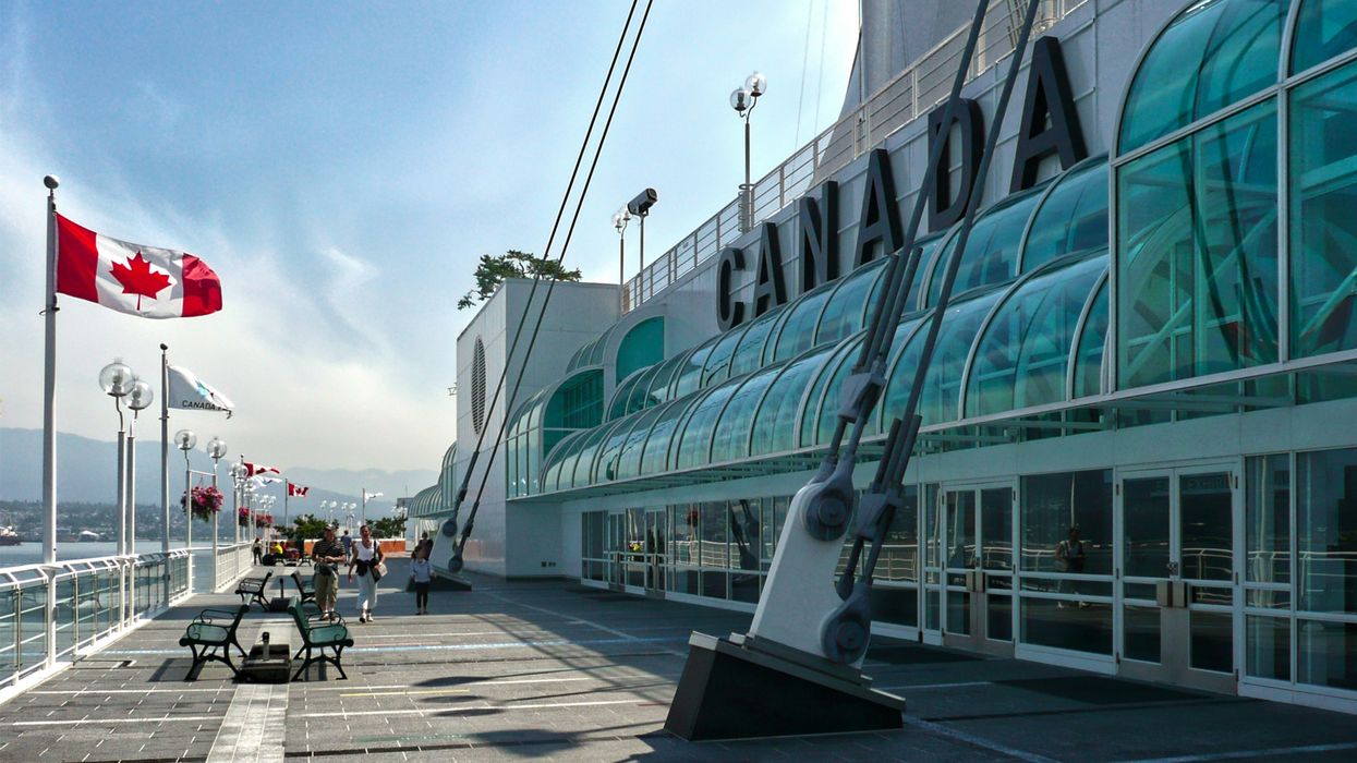 building in vancouver with canadian flag