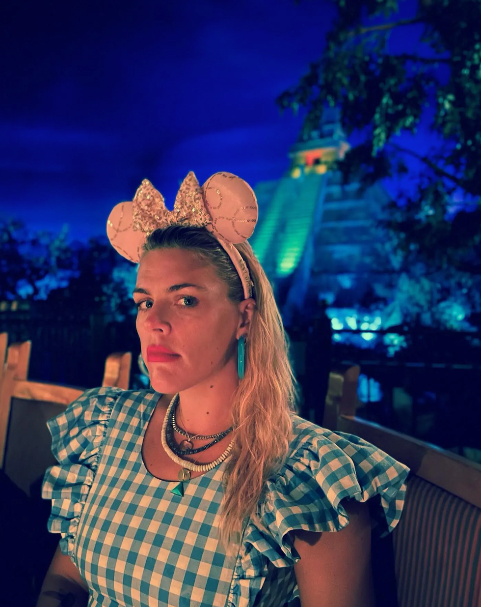 Busy Philipps with Mickey ears on.