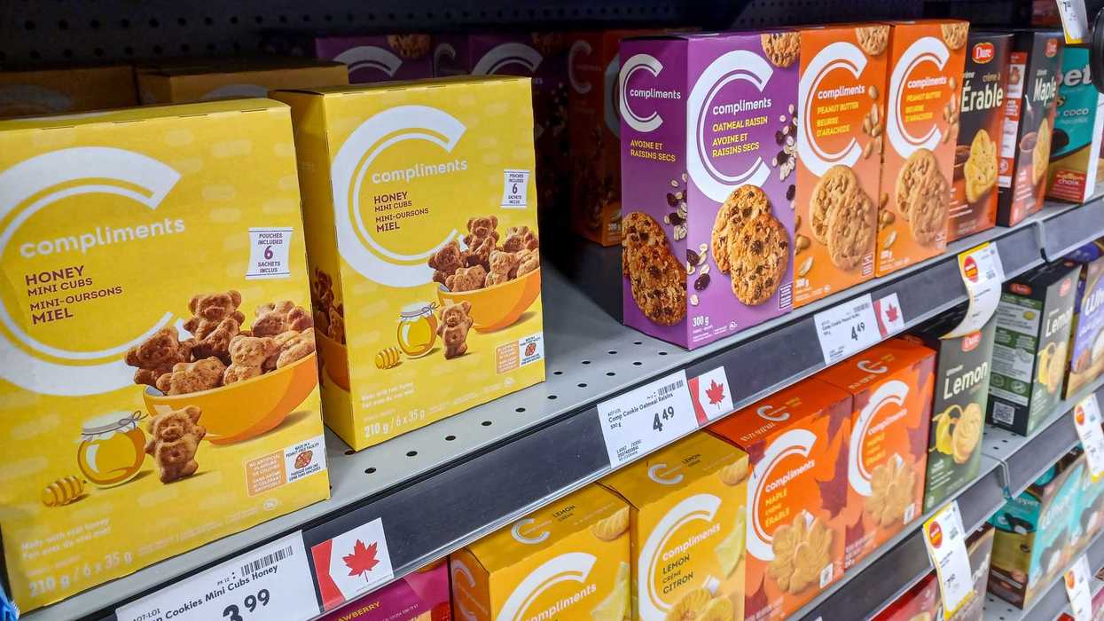 canada flag label on shelf of products at grocery store