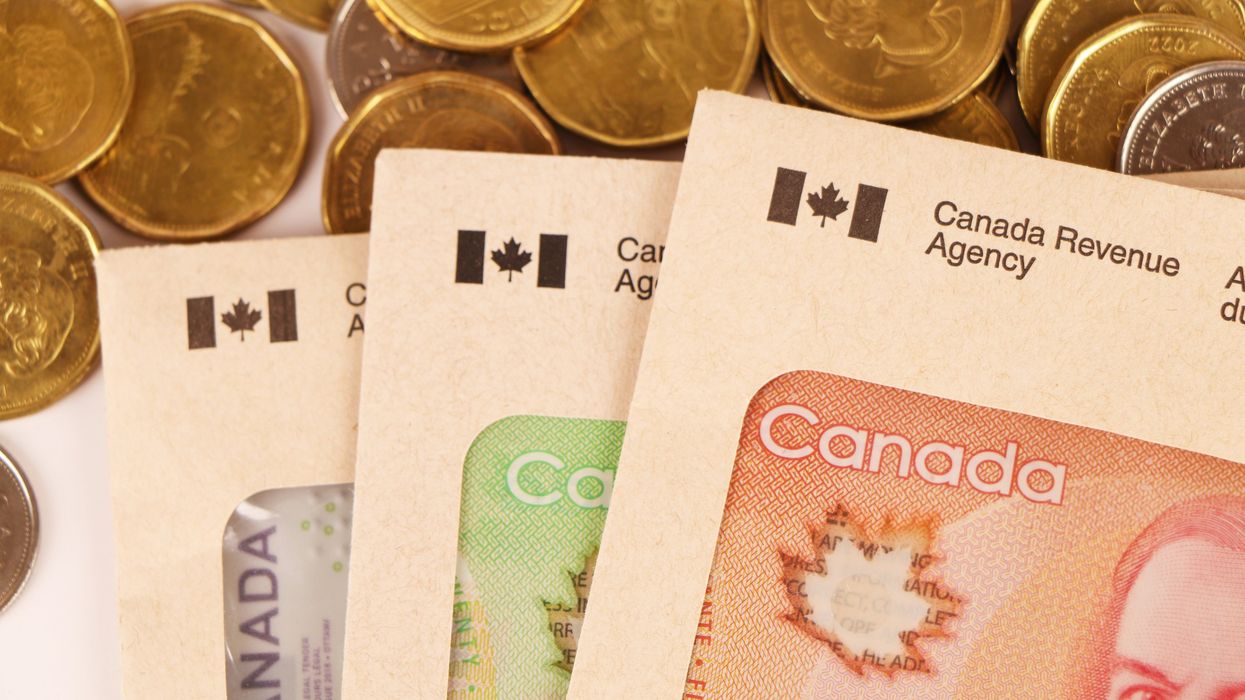 Canada Revenue Agency envelopes and Canadian cash.