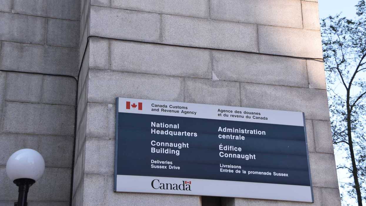 canada revenue agency sign on national headquarters building in ottawa