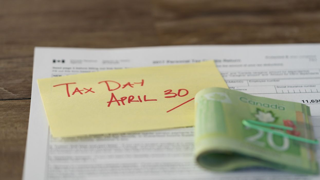 canada tax form with canadian money and note with tax deadline