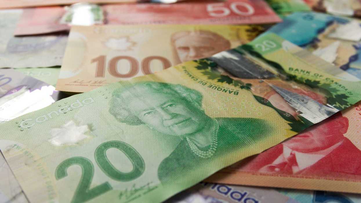 canadian $20 bill with $100 and $50 banknotes