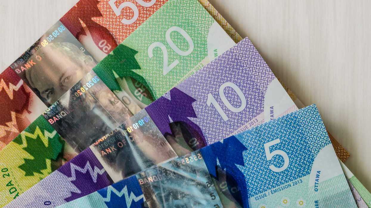 canadian $5, $10, $20 and $50 bills on a table