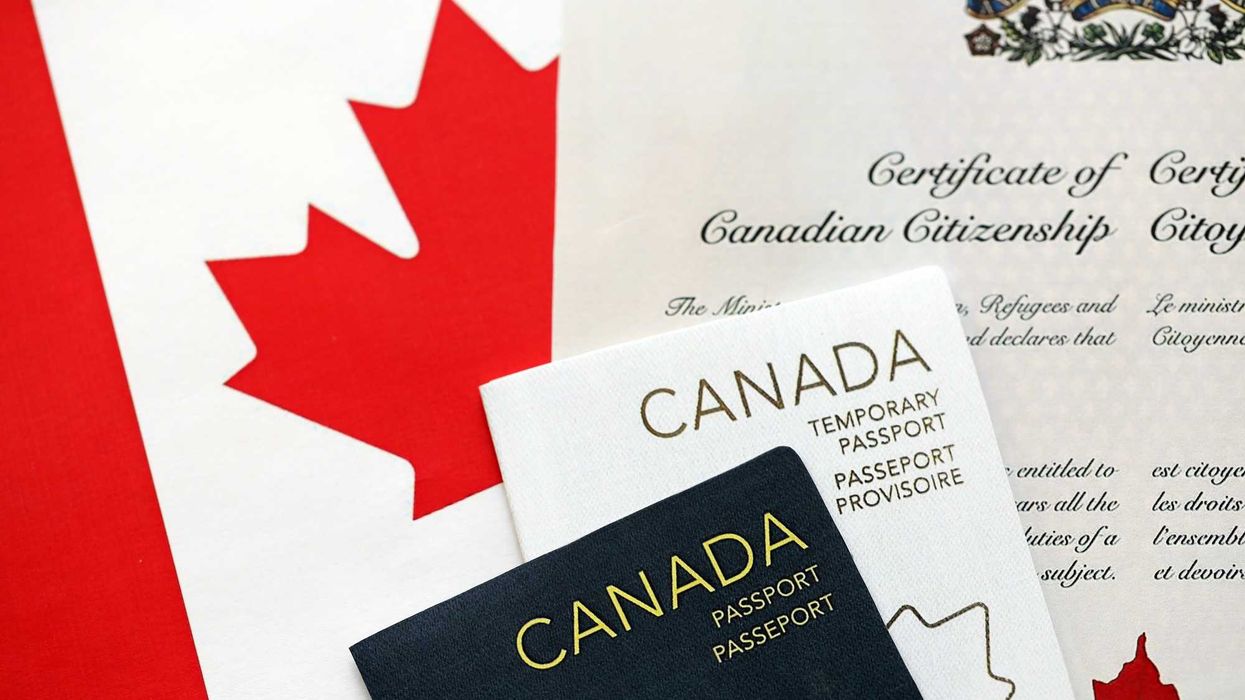 Canadian citizenship certificate, passports and flag.