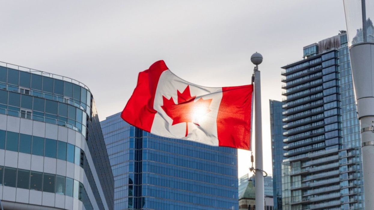Canadian flag in a city.