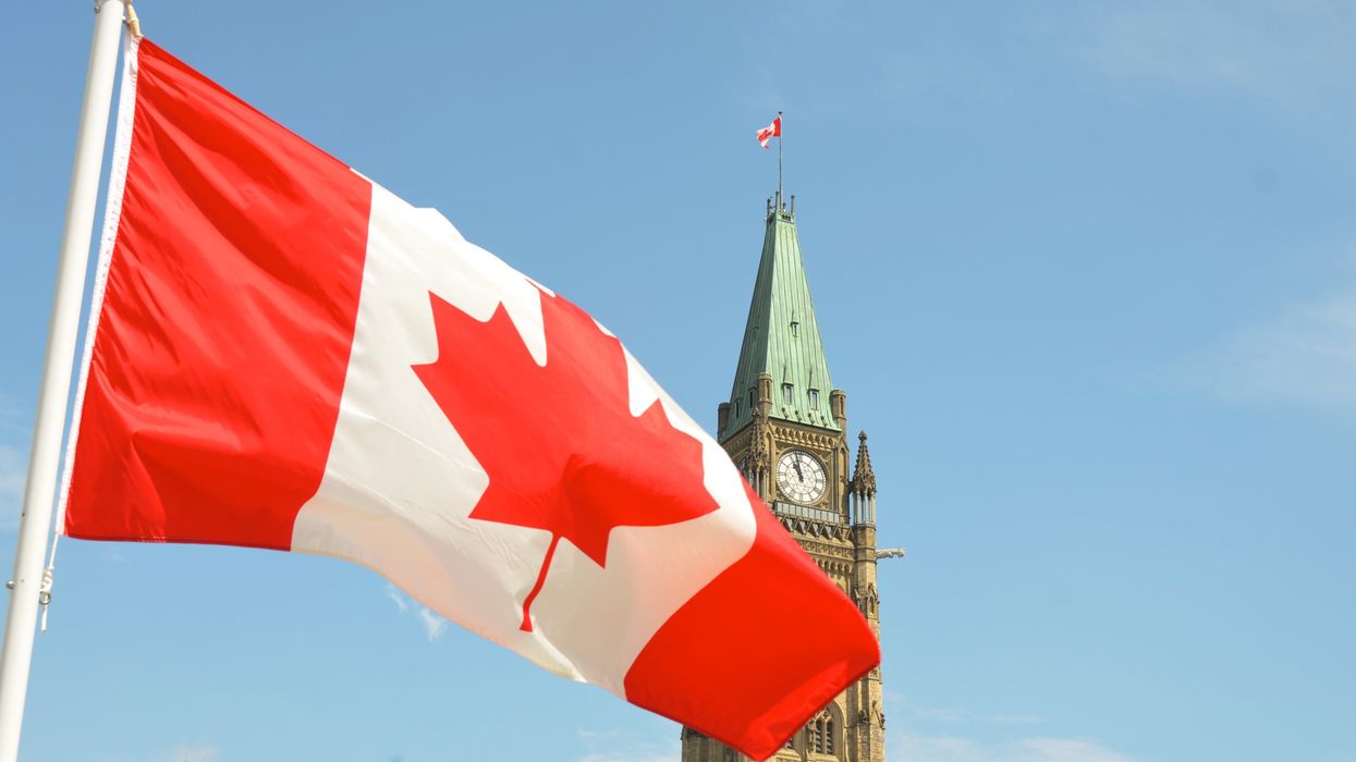 canadian flag on parliament hill in ottawa