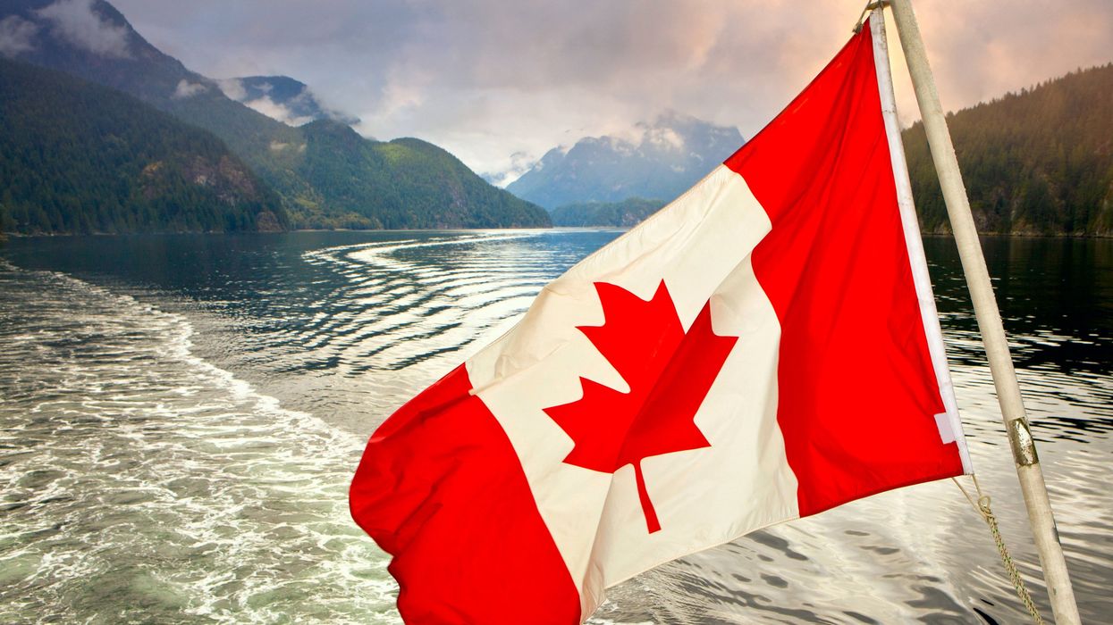 Canadian flag on the back of a boat on Indian Arm inlet near Vancouver.