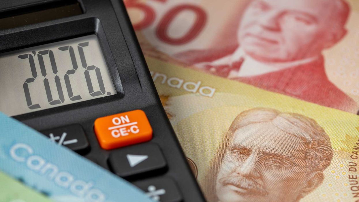 Canadian money and a calculator that reads "2026."
