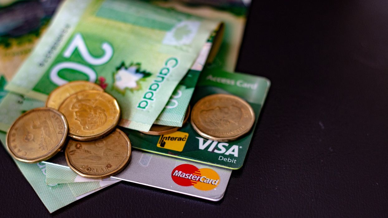 Canadian money on top of debit and credit cards.