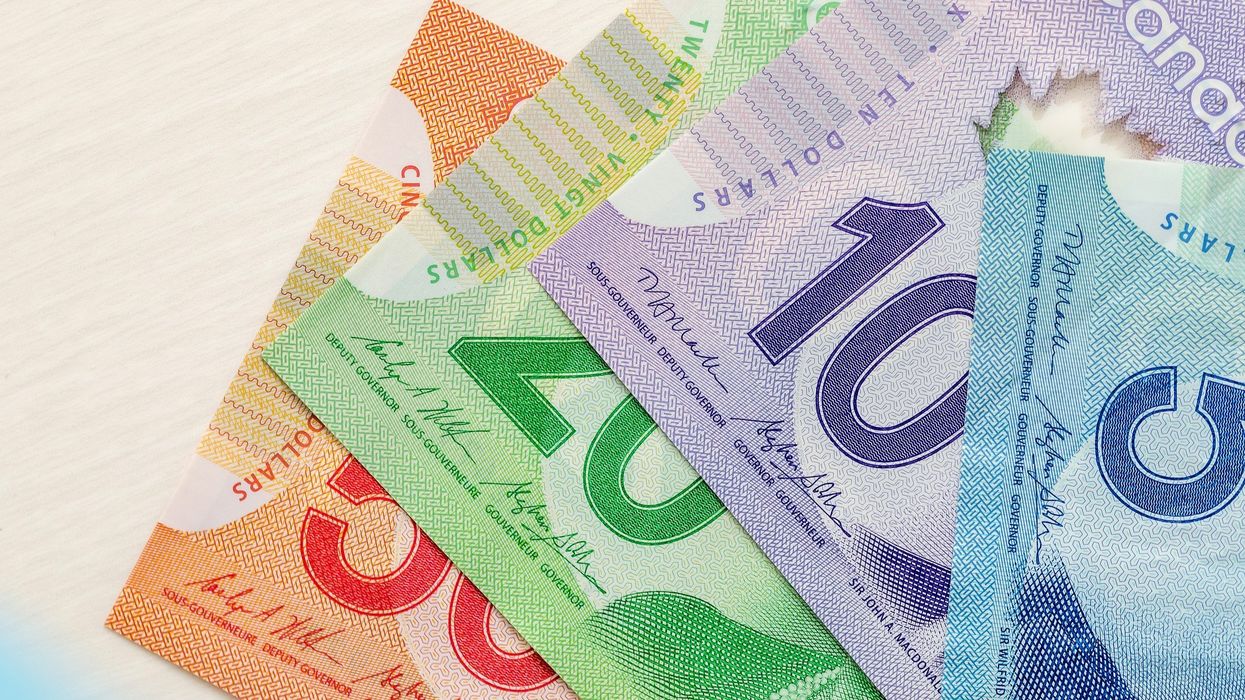 Canadian money spread out on a table.