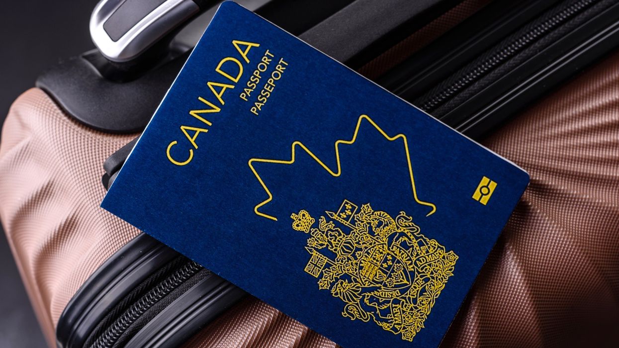 canadian passport on a suitcase