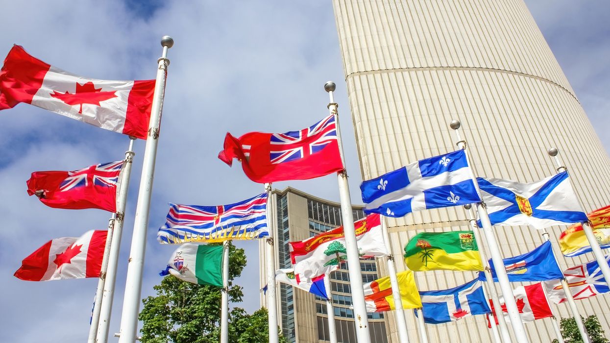Canadian, provincial and territorial flags flying in front of Toronto City Hall (illustrative).