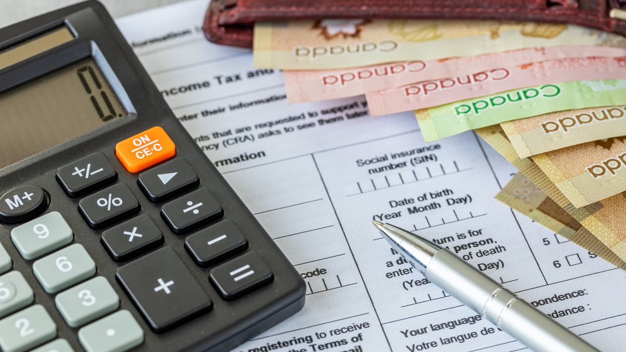 Canadian tax forms and money (illustrative).