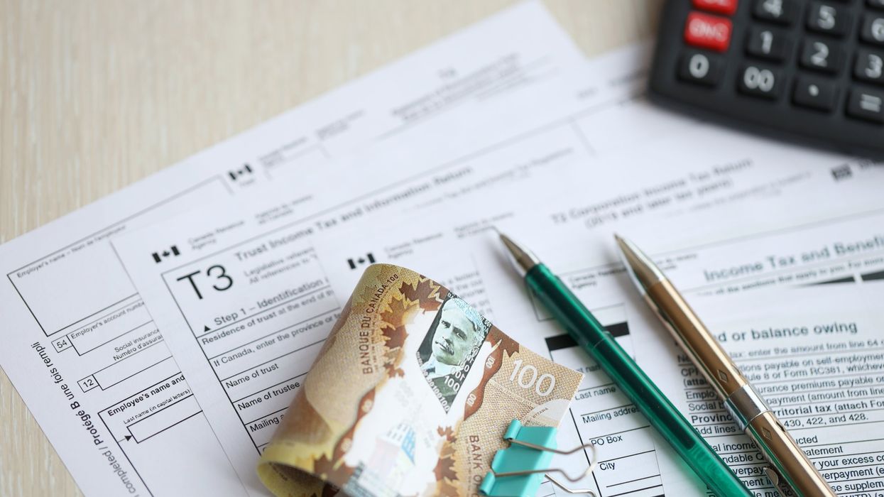Canadian tax forms and money (illustrative).