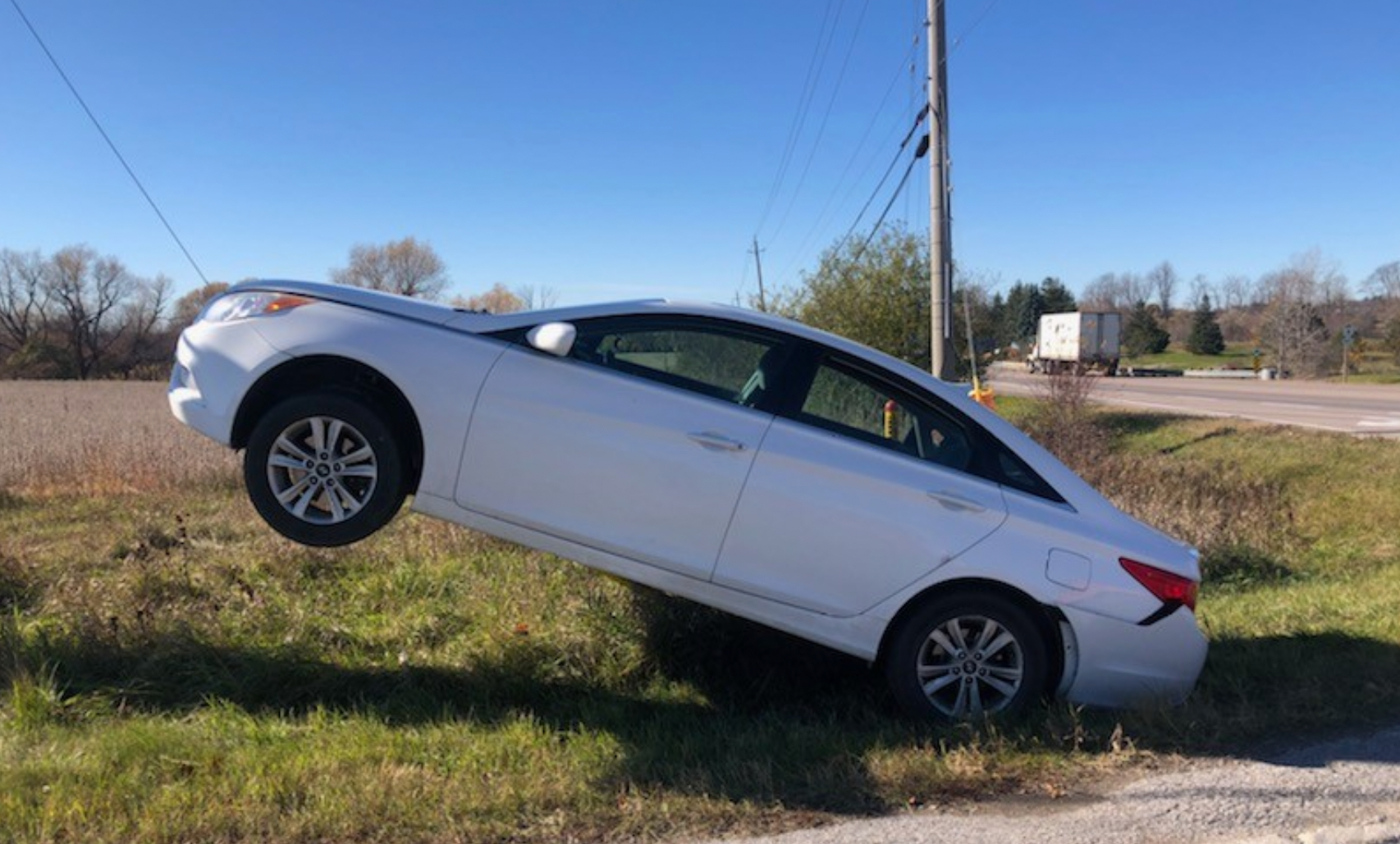 Car floating in mid-air on an Ontario road.