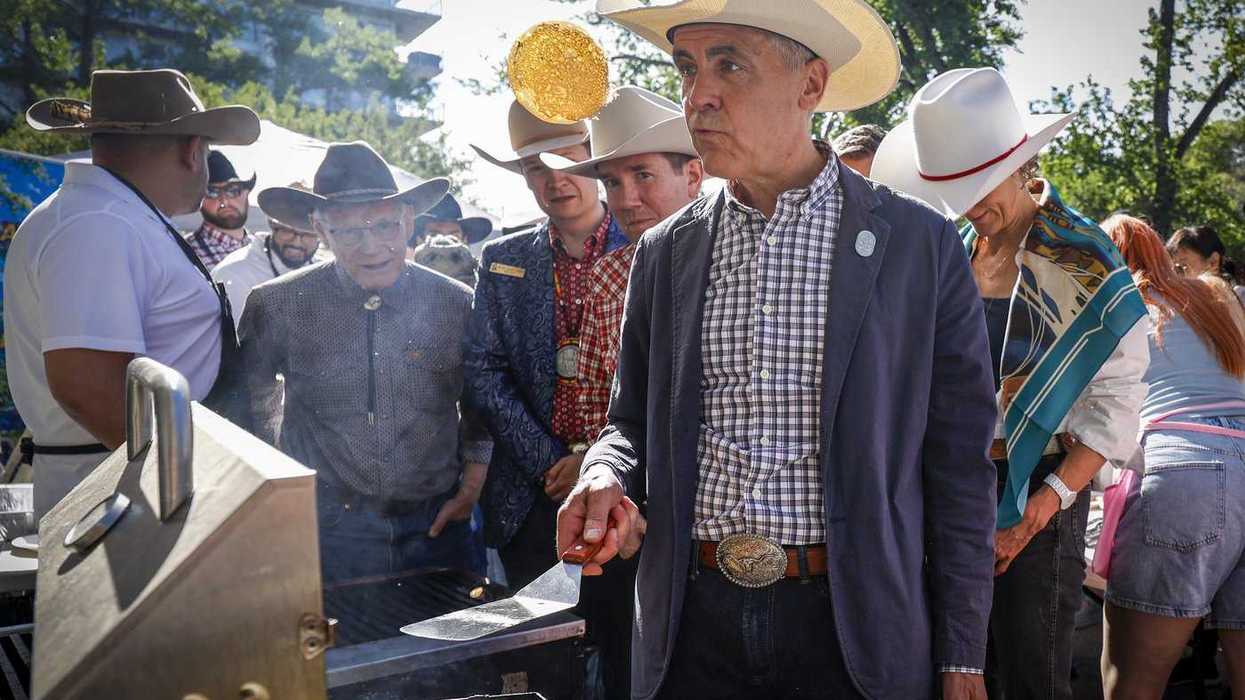 Carney wraps up Stampede visit flipping pancakes