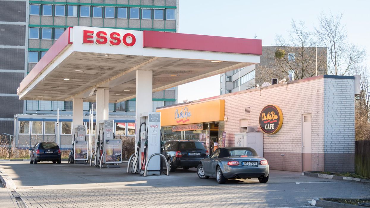 Cars at an Esso gas station.