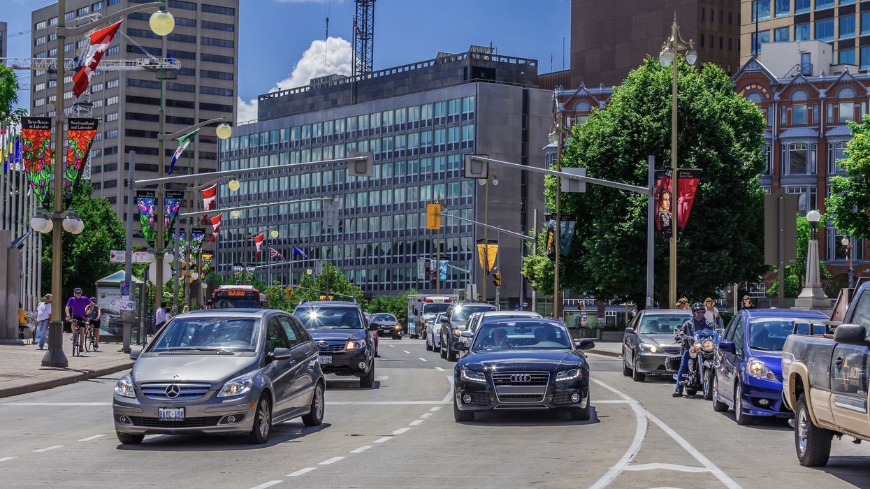 Cars driving along a street in Ottawa, Ontario.