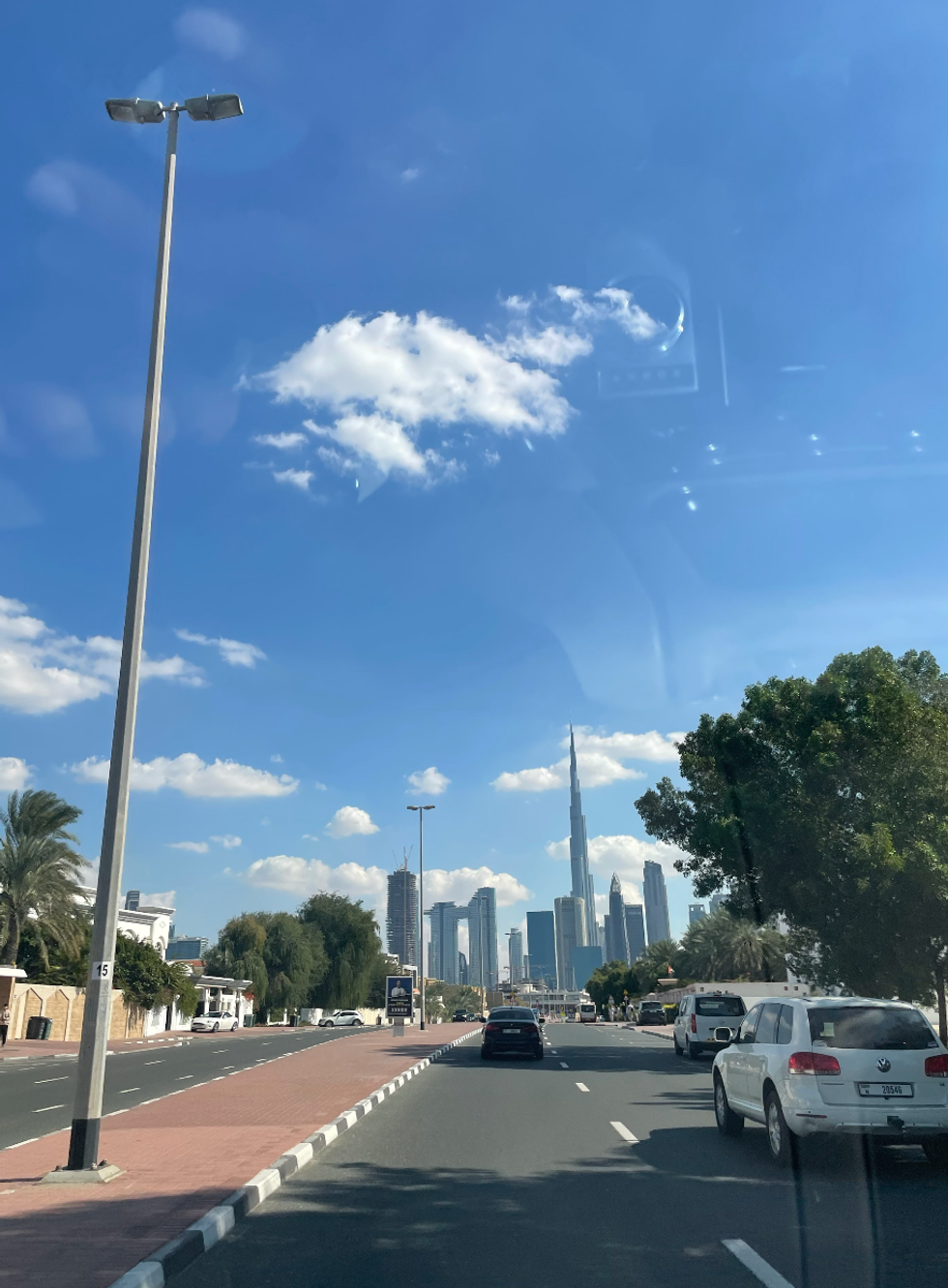 Cars driving down a road in Dubai.