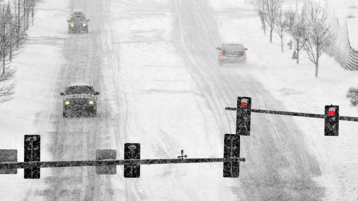 Cars driving in snow.