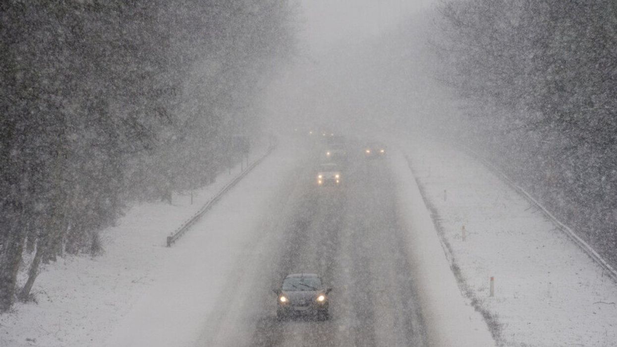 Cars driving in snow.