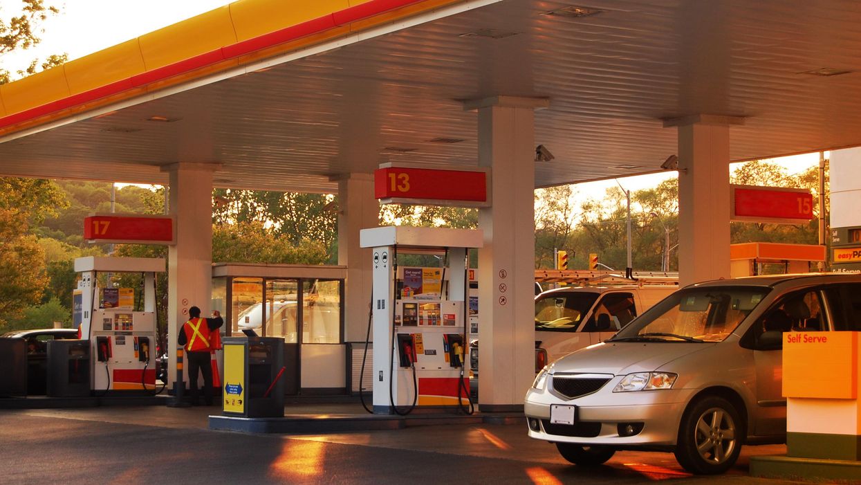 Cars filling up at a gas station.