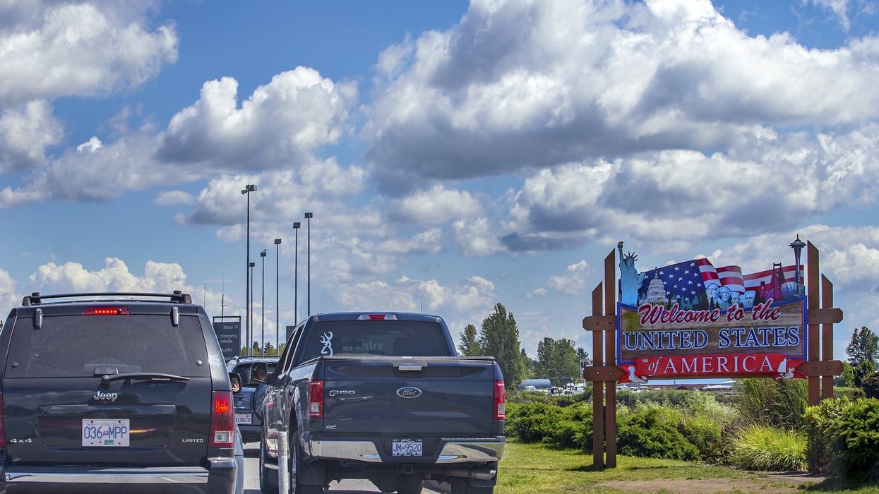 Cars line up at the Canada-U.S. border.