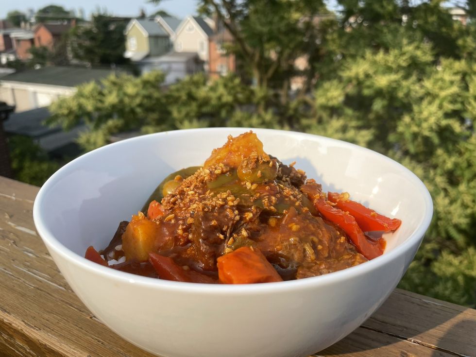 Casa Manila's Beef Kaldereta Tropical Tomato Stew with Potato, Carrots, Bell Peppers, and Jasmine Rice.