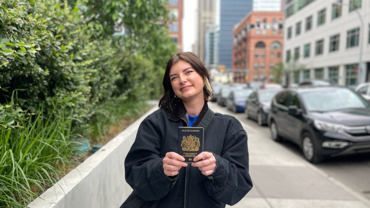 Charlie holding a passport.