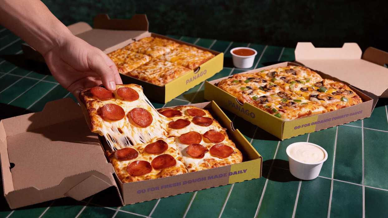 Cheese, Pepperoni or Veggie Pan Pizzas arranged on a counter with dip.