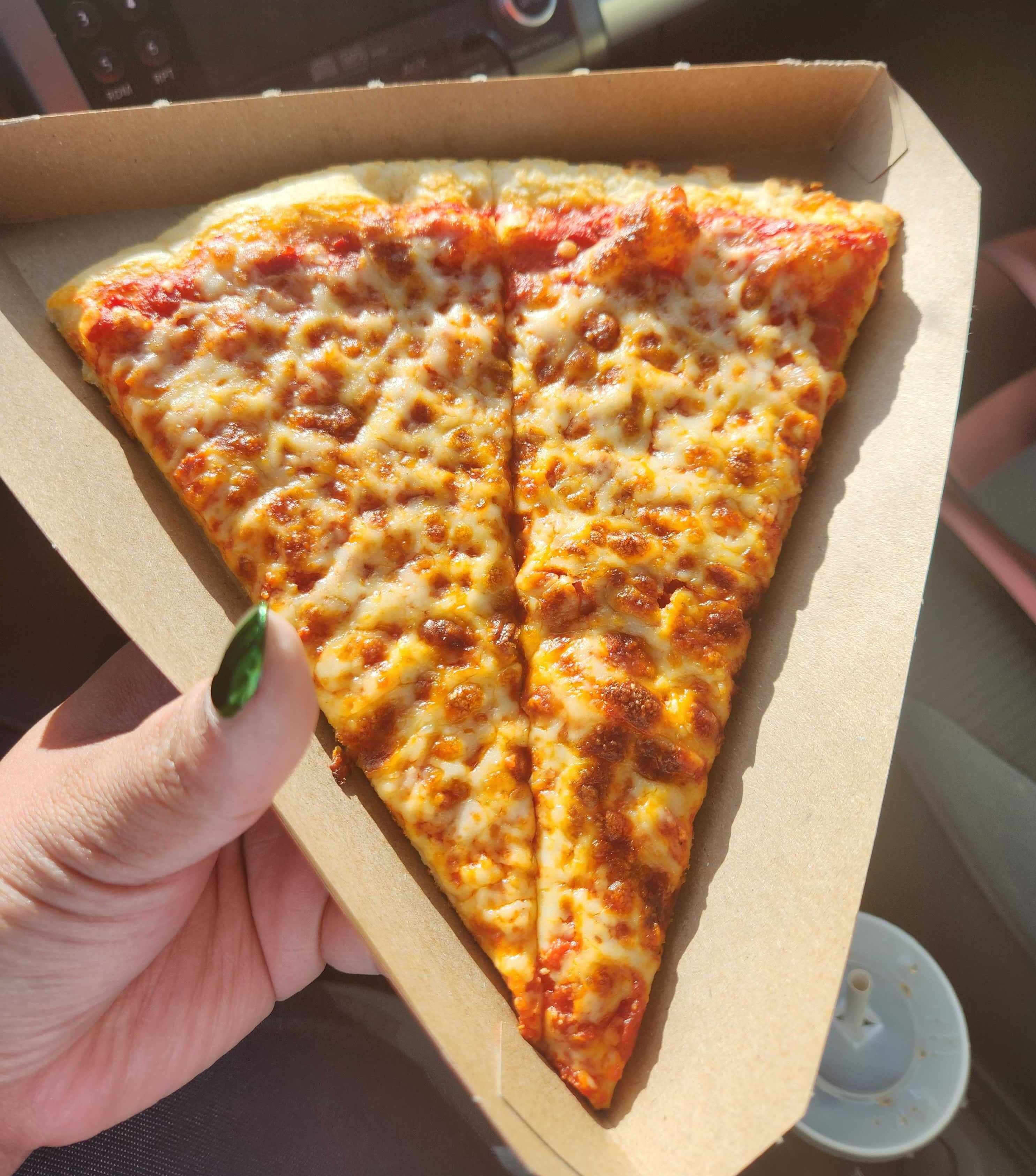 Cheese pizza from Pizza Pizza that cost $3.94.