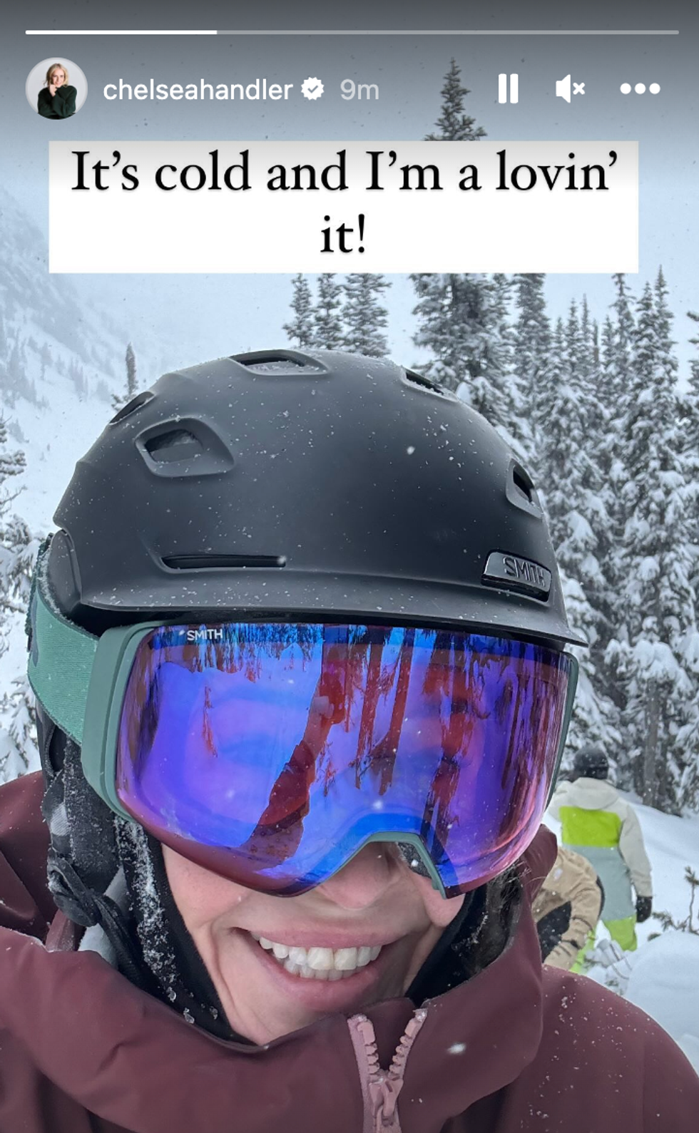 Chelsea Handler with ski goggles and a helmet smiling for a selfie.