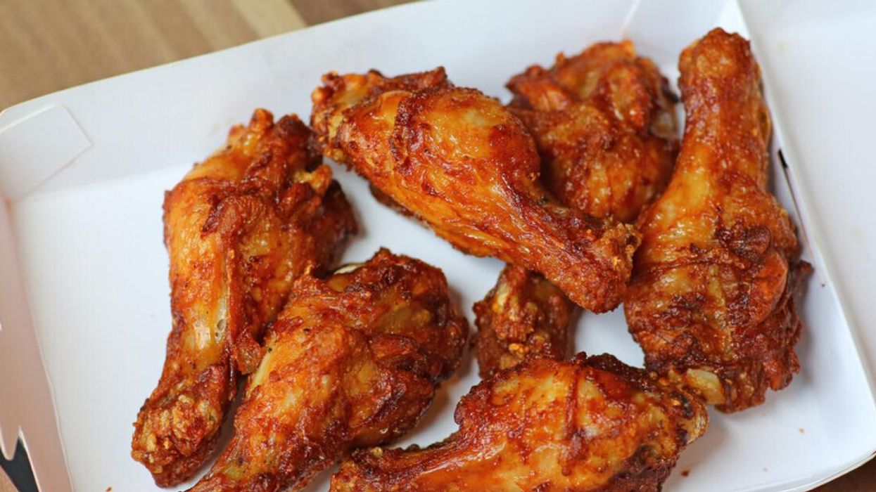 Chicken wings in a cardboard delivery box.