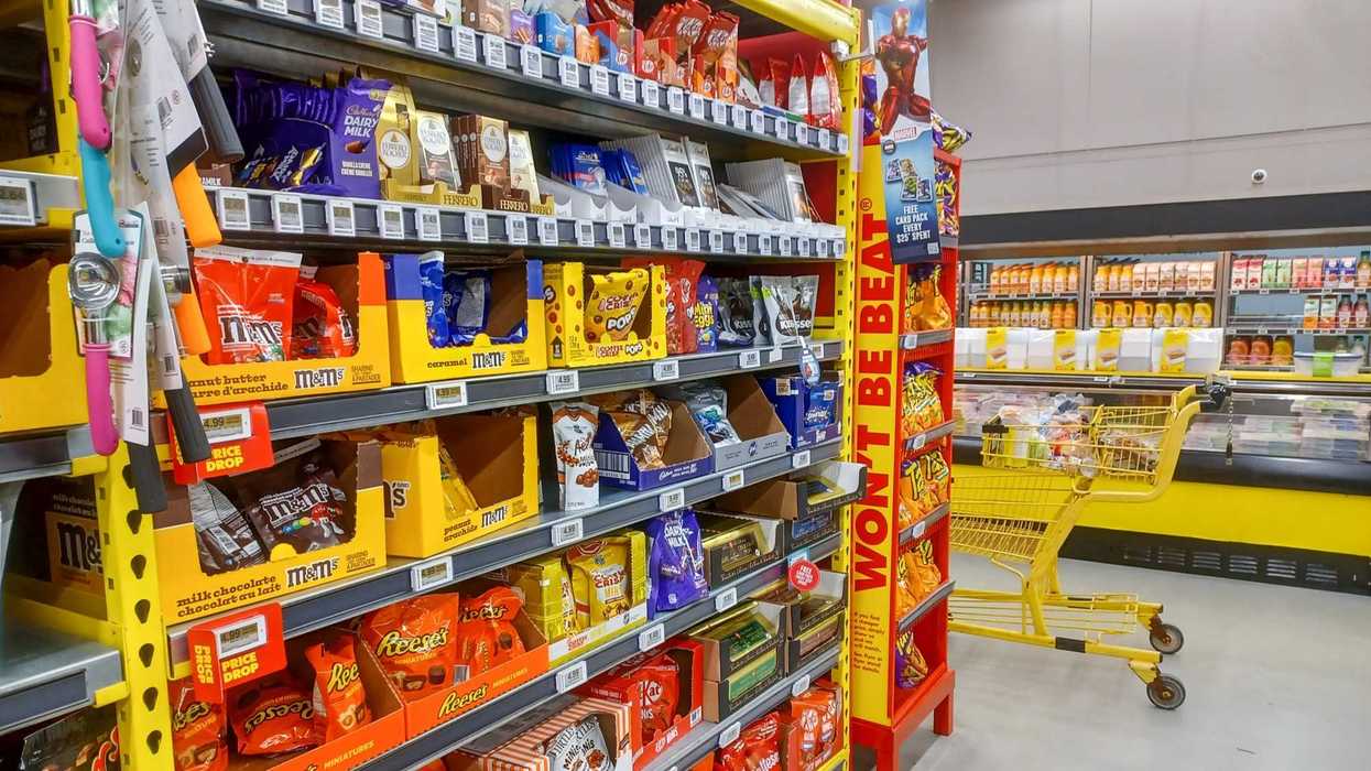 chocolate products on shelves in aisle at grocery store in canada