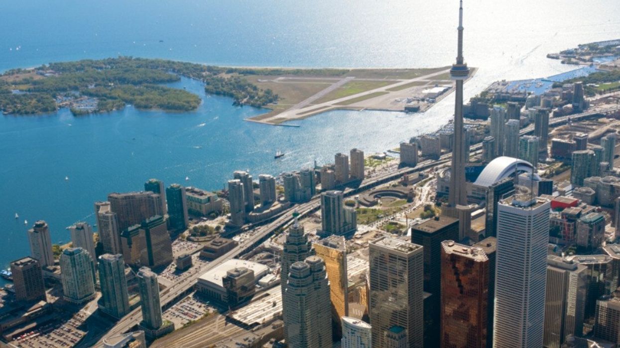 City views of Toronto with tall buildings and the CN Tower.