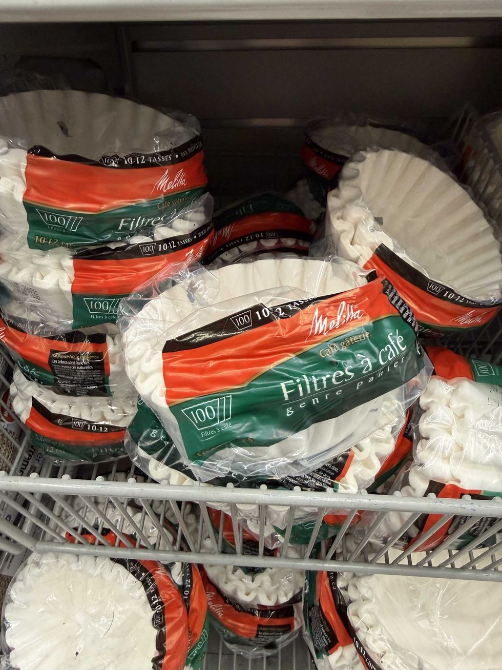 Clear bags with red and green labels that say coffee filters on them.