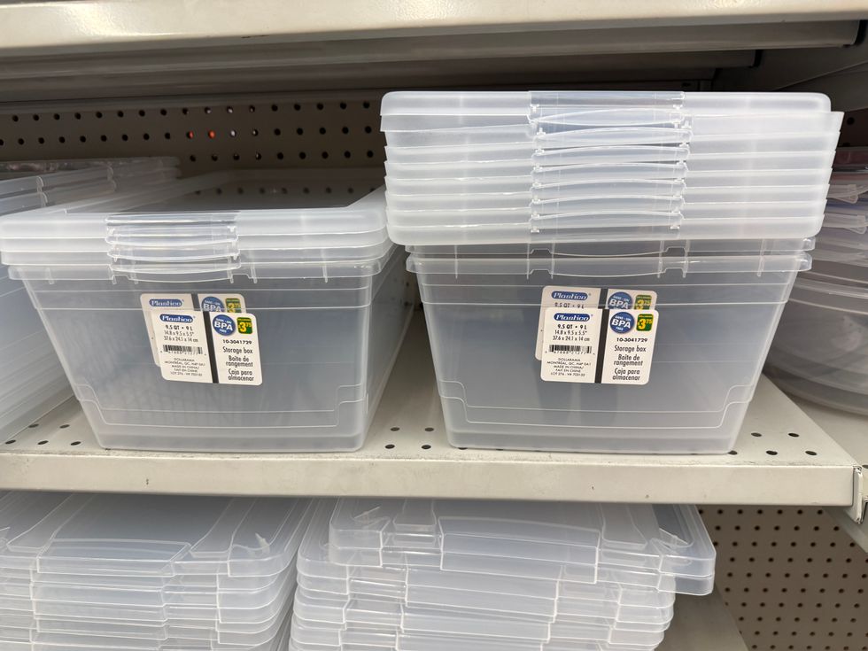 Clear plastic bins on a store shelf.