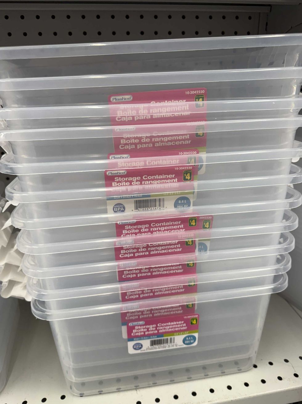 Clear storage containers stacked on top of each other on a store shelf.