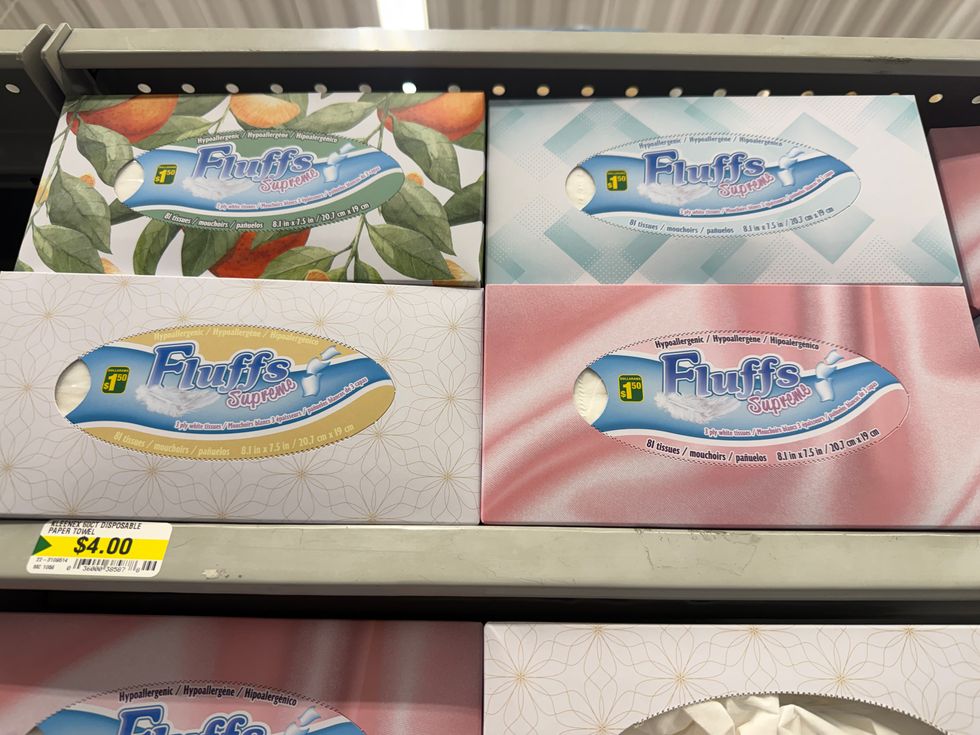 Colourful boxes on a store shelf with the label reading hypoallergenic Fluffs Supreme facial tissues.