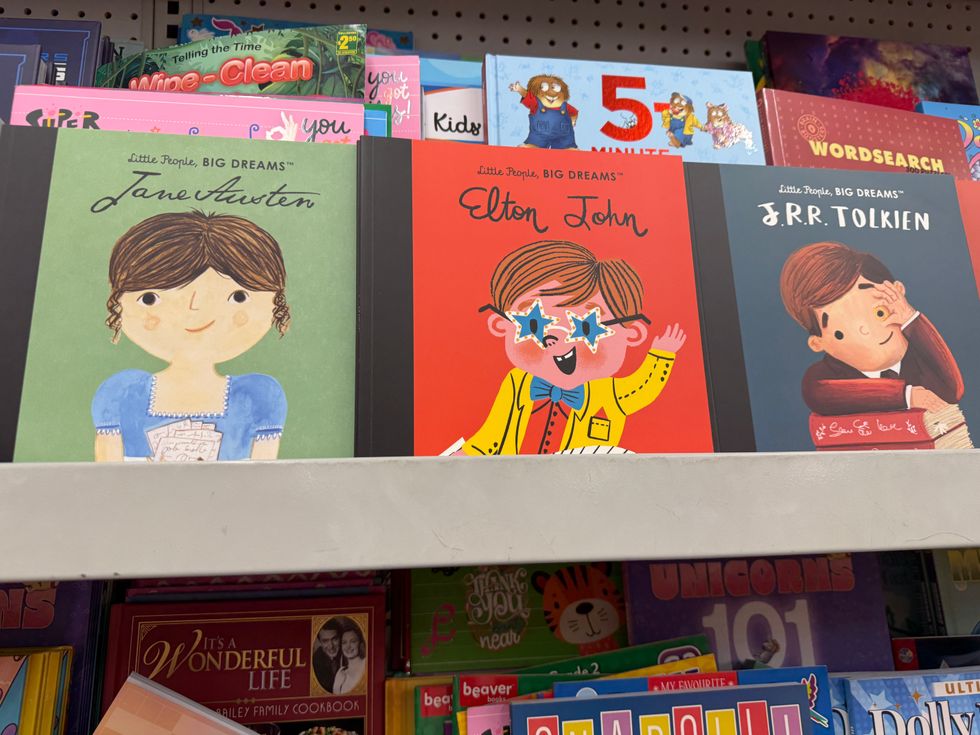 Colourful kids books on a store shelf.