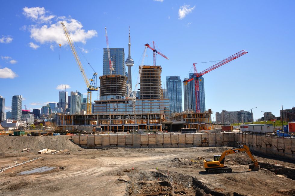 Construction in downtown Toronto with the CN Tower in the background.