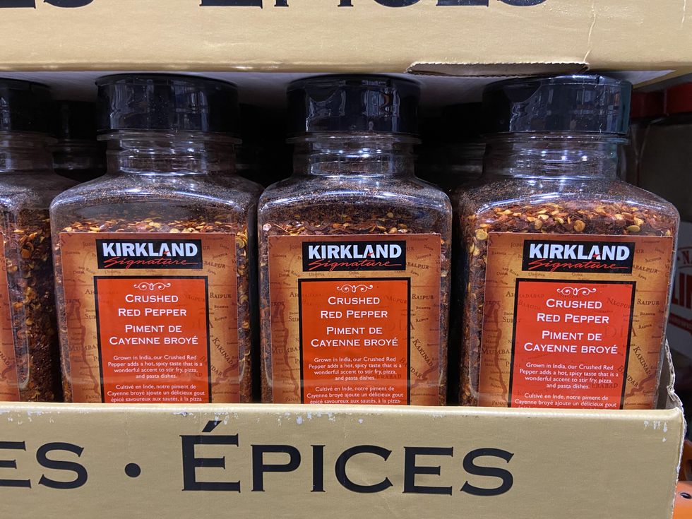 Container of crushed red pepper spice.