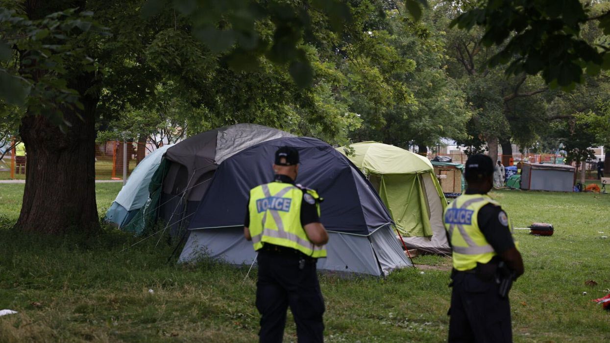 Cops Clearing Toronto Encampment March To 'Star Wars' Song Played By Activists