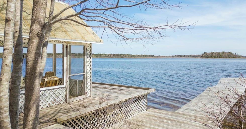 Covered sitting area and dock on the ocean.