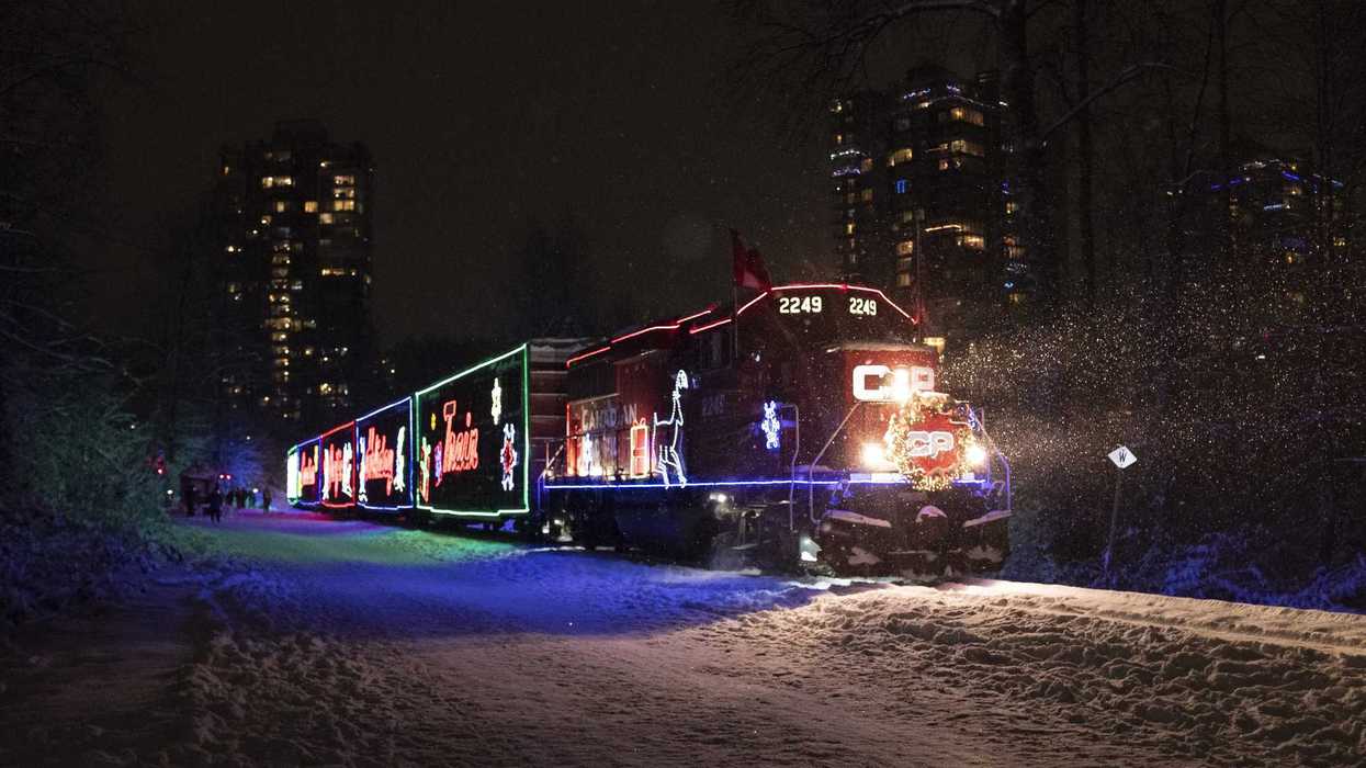 cp holiday train on tracks during snowfall in port moody bc in 2022