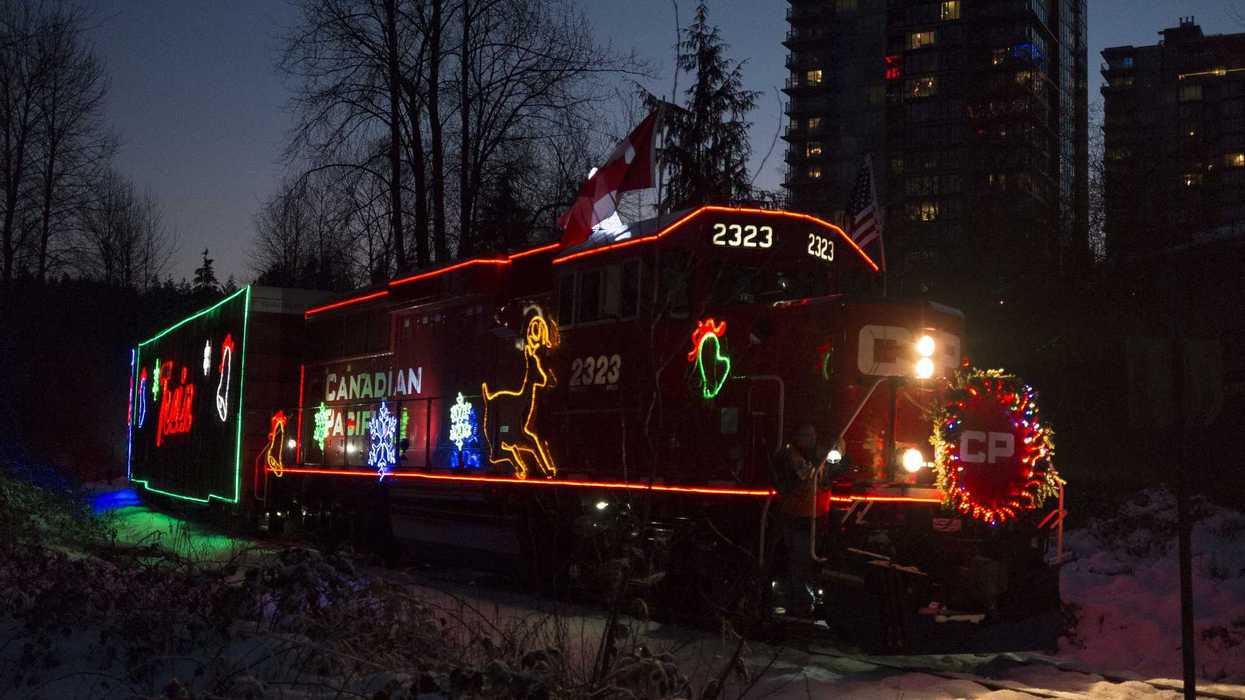 cp holiday train with lights in city in canada in 2022